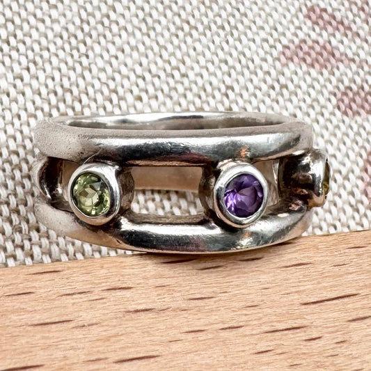 Silver multi-stone ring with open band design, size O.5 (US 7.5)