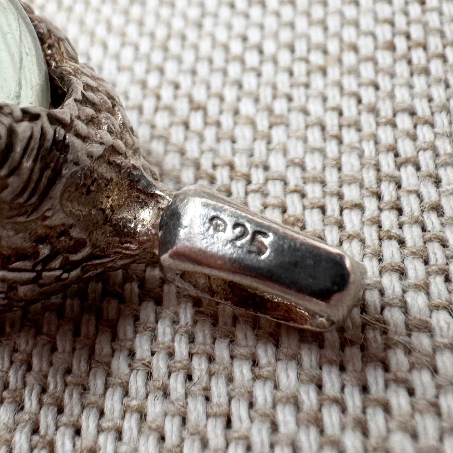 Silver pendant with pale green glass sphere