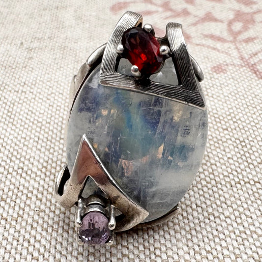 Silver moonstone ring with lilac and red stone accents, size R.5 (US 9)
