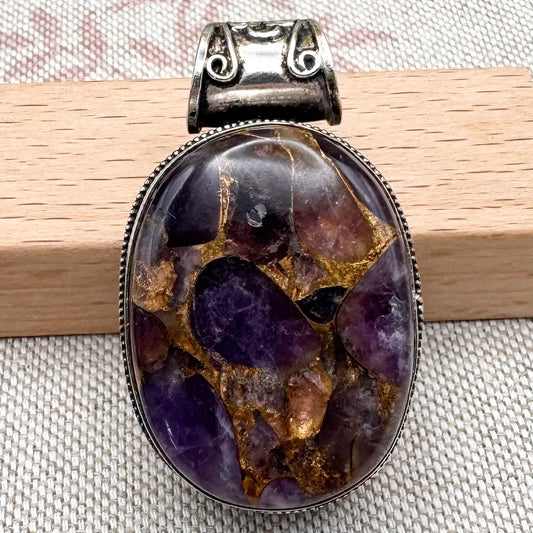 Chunky silver pendant with purple composite stone