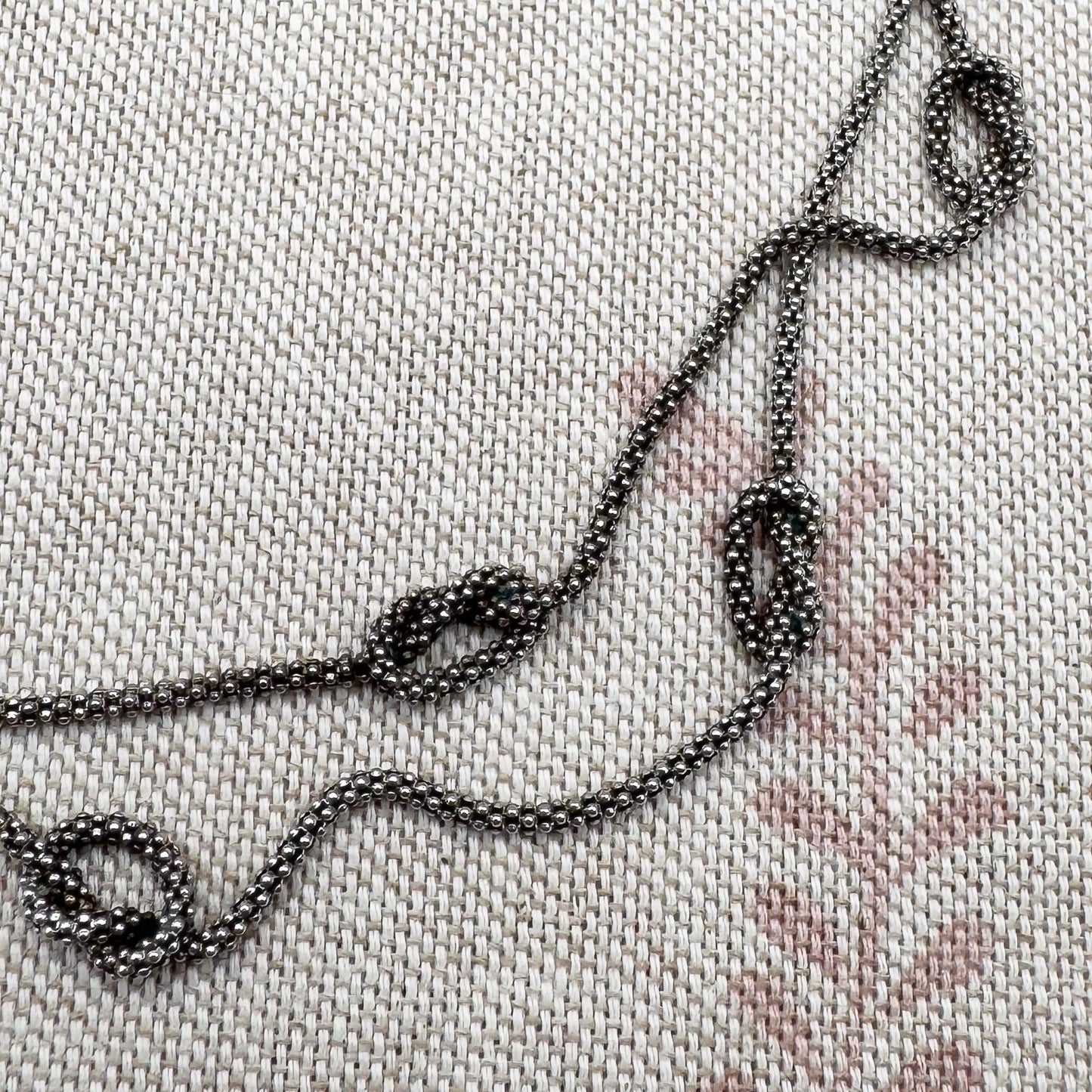 Close-up of embroidered chain on fabric