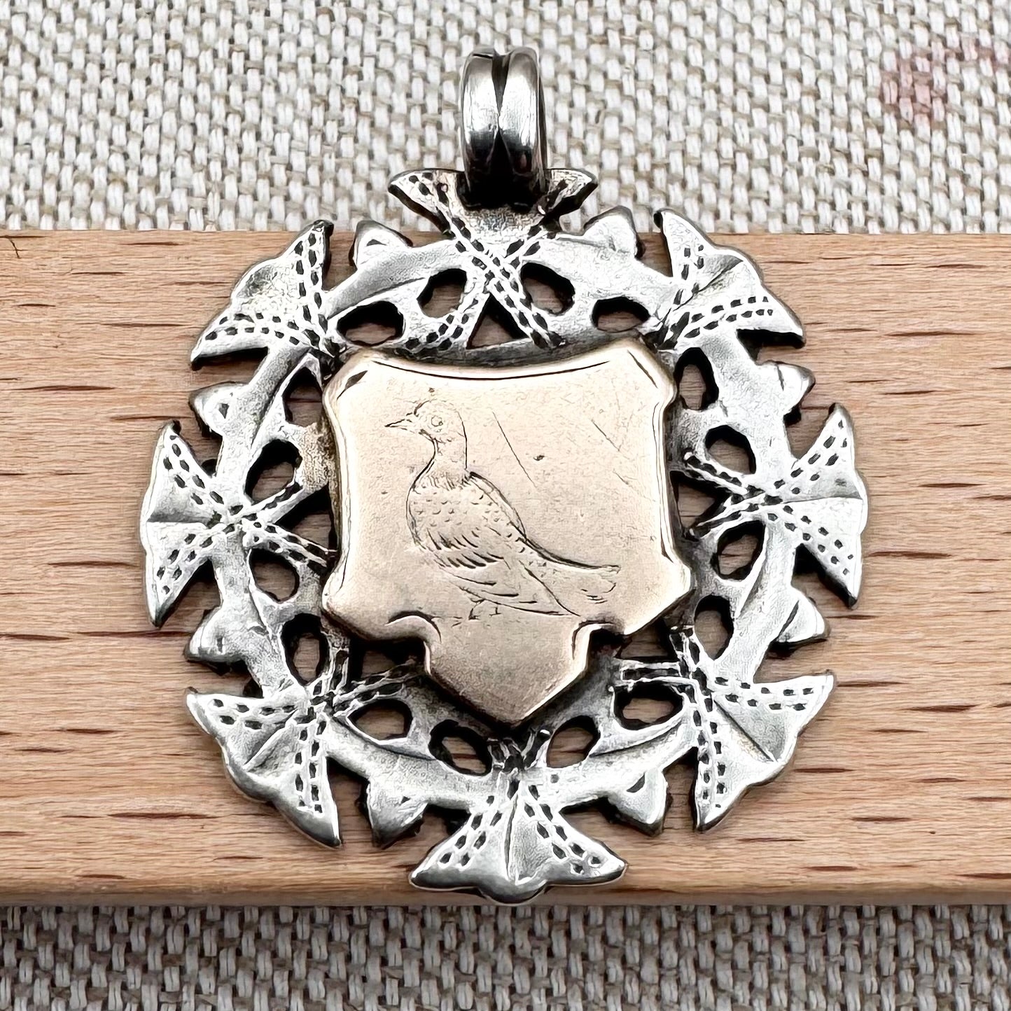 Antique silver & gilded pigeon fob medal, hallmarked for Birmingham, c.1894
