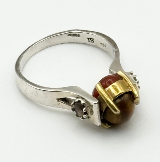 Spinner ring with carnelian and tiger eye stones with a brass setting and silver ring