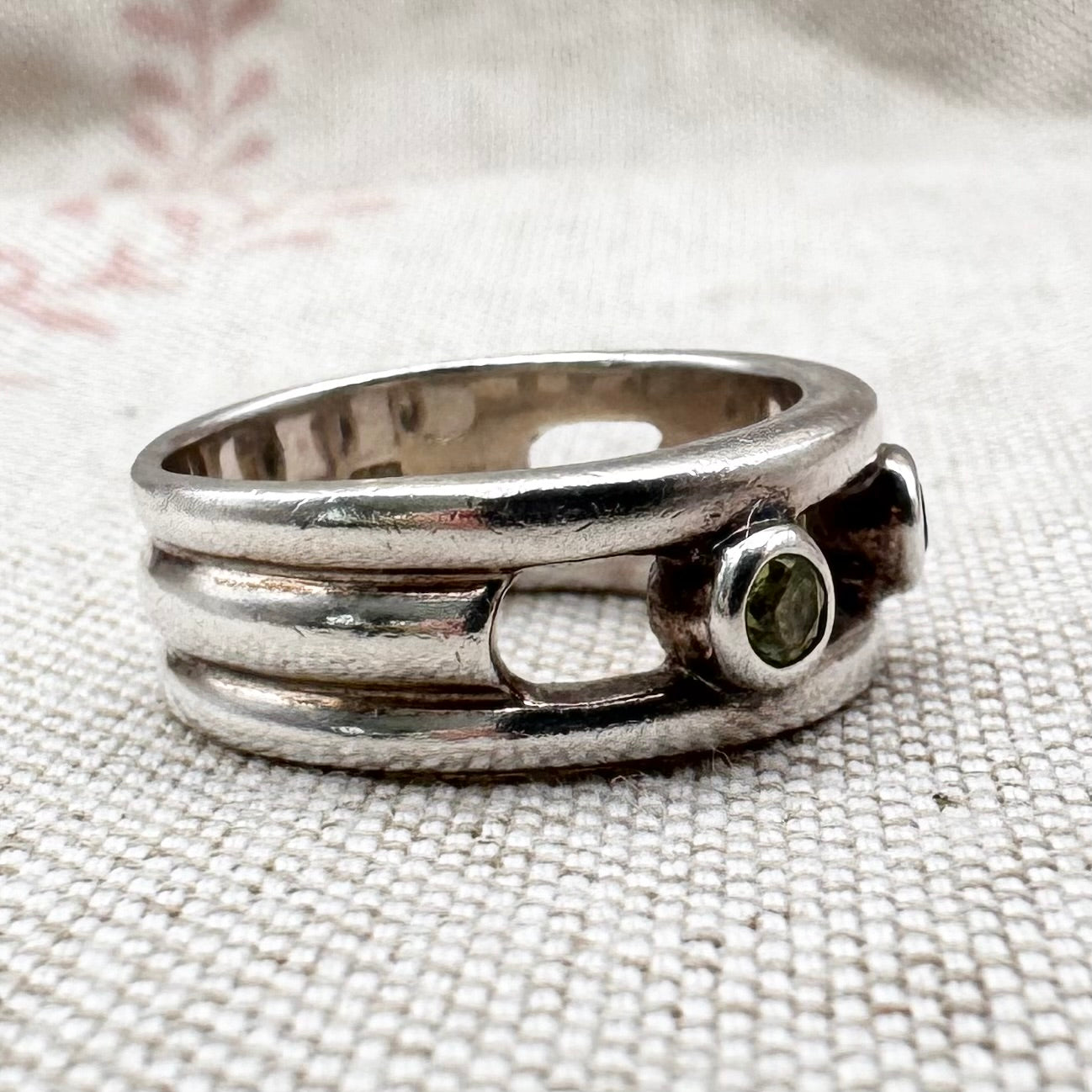 Silver multi-stone ring with open band design, size O.5 (US 7.5)