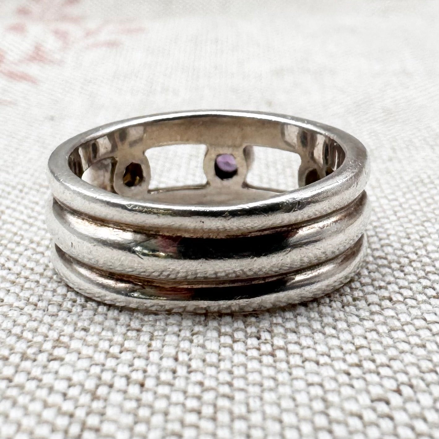 Silver multi-stone ring with open band design, size O.5 (US 7.5)