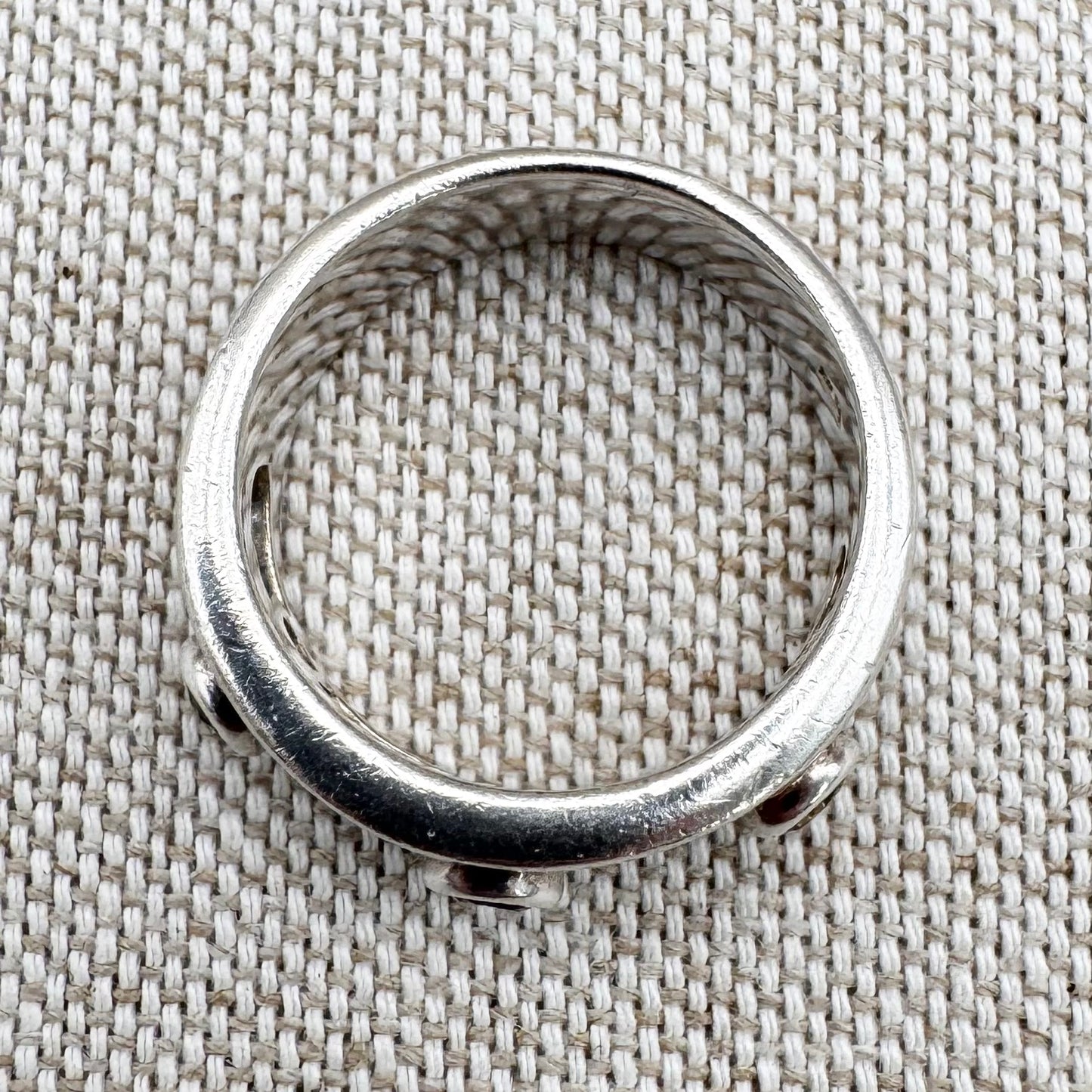 Silver multi-stone ring with open band design, size O.5 (US 7.5)