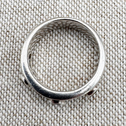 Silver multi-stone ring with open band design, size O.5 (US 7.5)