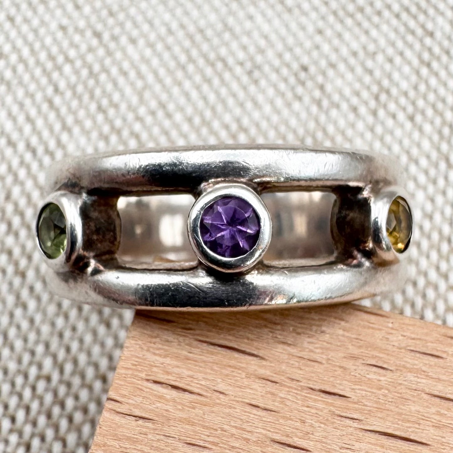 Silver multi-stone ring with open band design, size O.5 (US 7.5)