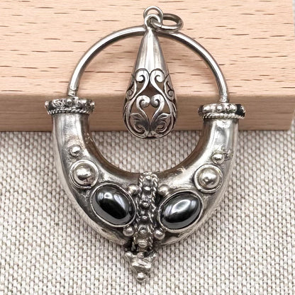 Balinese style pendant with double hematite