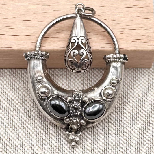 Balinese style pendant with double hematite