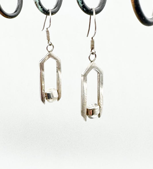 Geometric moonstone drop earrings with spinning elements