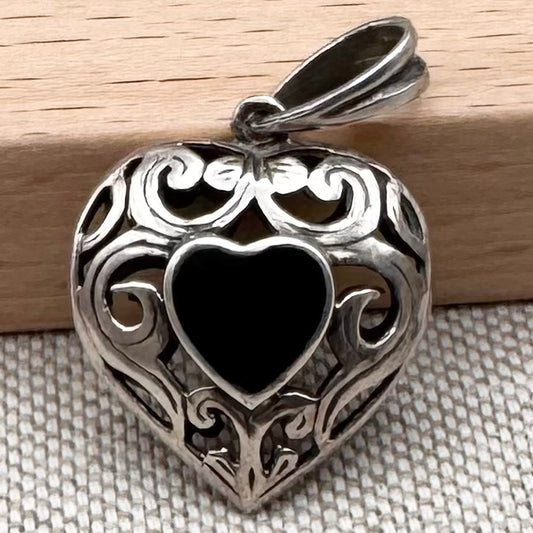 Dual heart-shaped pendant with black onyx stones