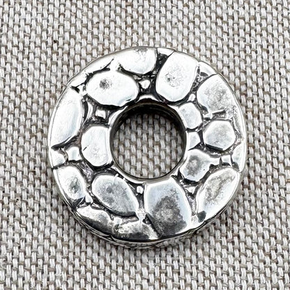 Textured silver pebble pendant