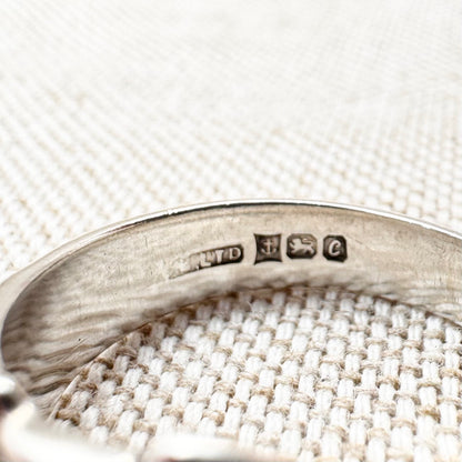 Silver buckle ring with floral detail, hallmarked Birmingham 1977, size M (US 6.25)