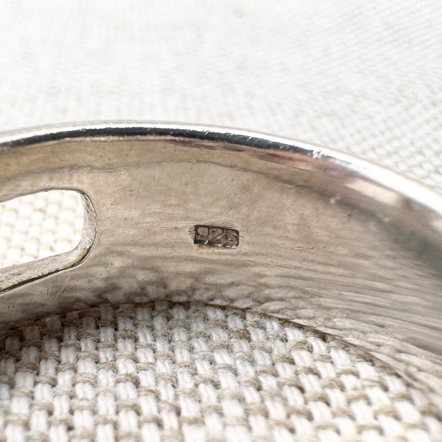 Silver multi-stone ring with open band design, size O.5 (US 7.5)