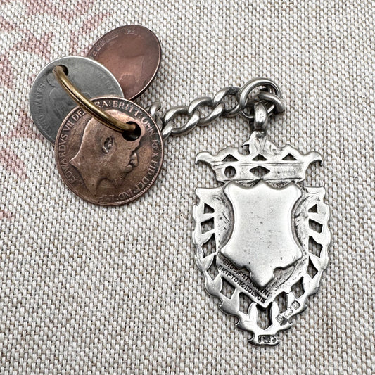 Edwardian silver medallion keyring with historic coin charms, hallmarked Birmingham 1906