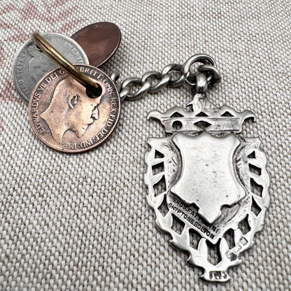 Edwardian silver medallion keyring with historic coin charms, hallmarked Birmingham 1906