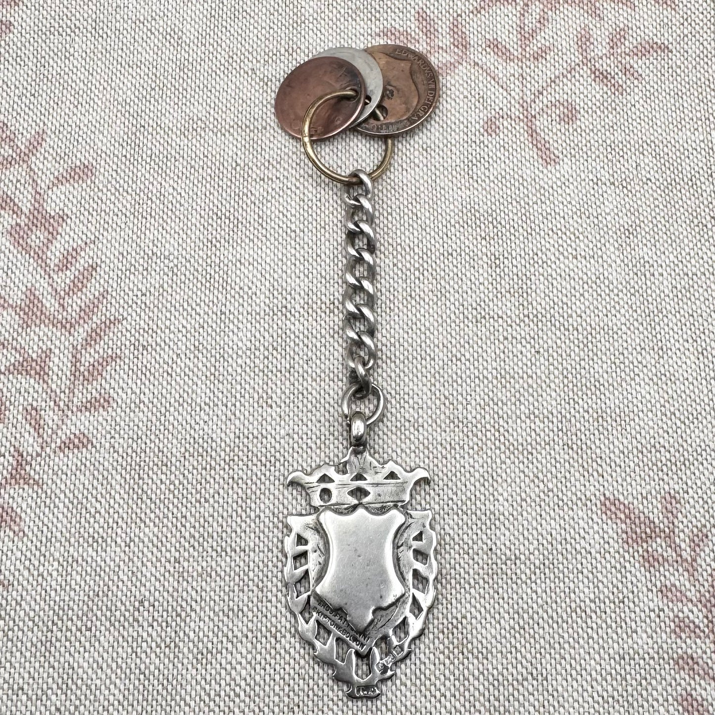 Edwardian silver medallion keyring with historic coin charms, hallmarked Birmingham 1906
