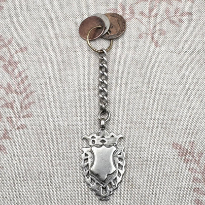 Edwardian silver medallion keyring with historic coin charms, hallmarked Birmingham 1906