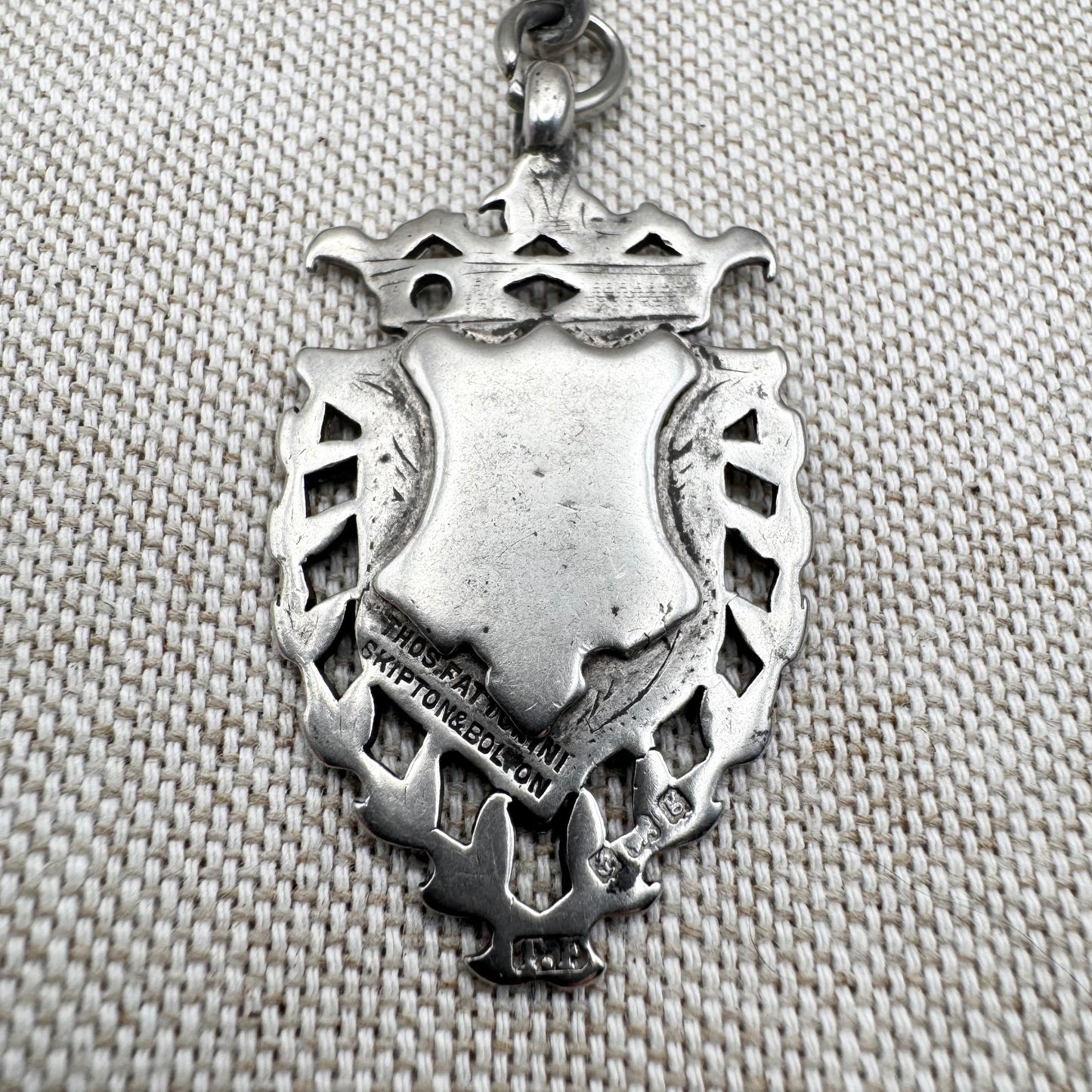 Edwardian silver medallion keyring with historic coin charms, hallmarked Birmingham 1906