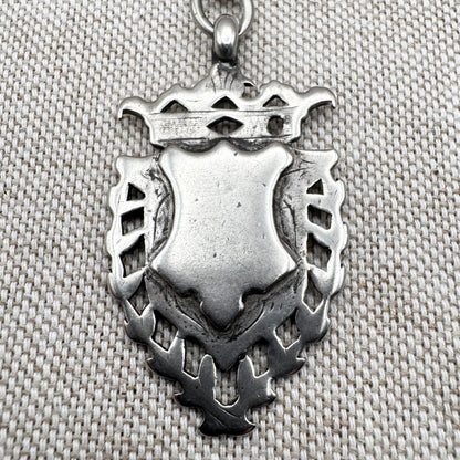 Edwardian silver medallion keyring with historic coin charms, hallmarked Birmingham 1906