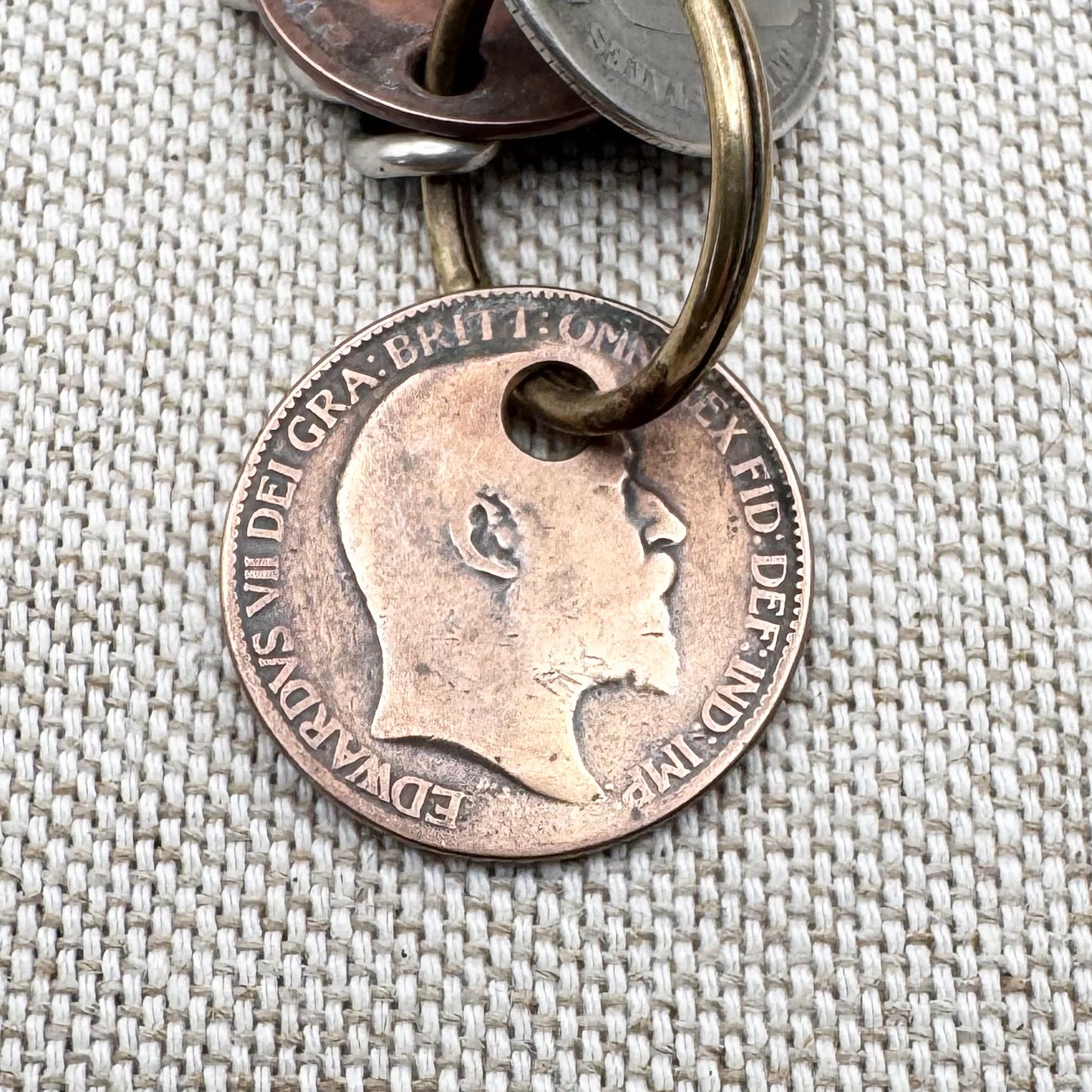 Edwardian silver medallion keyring with historic coin charms, hallmarked Birmingham 1906