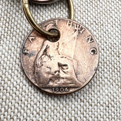 Edwardian silver medallion keyring with historic coin charms, hallmarked Birmingham 1906