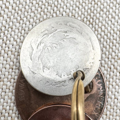 Edwardian silver medallion keyring with historic coin charms, hallmarked Birmingham 1906