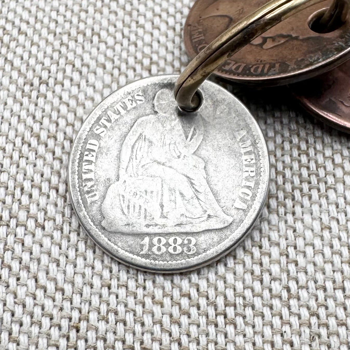 Edwardian silver medallion keyring with historic coin charms, hallmarked Birmingham 1906