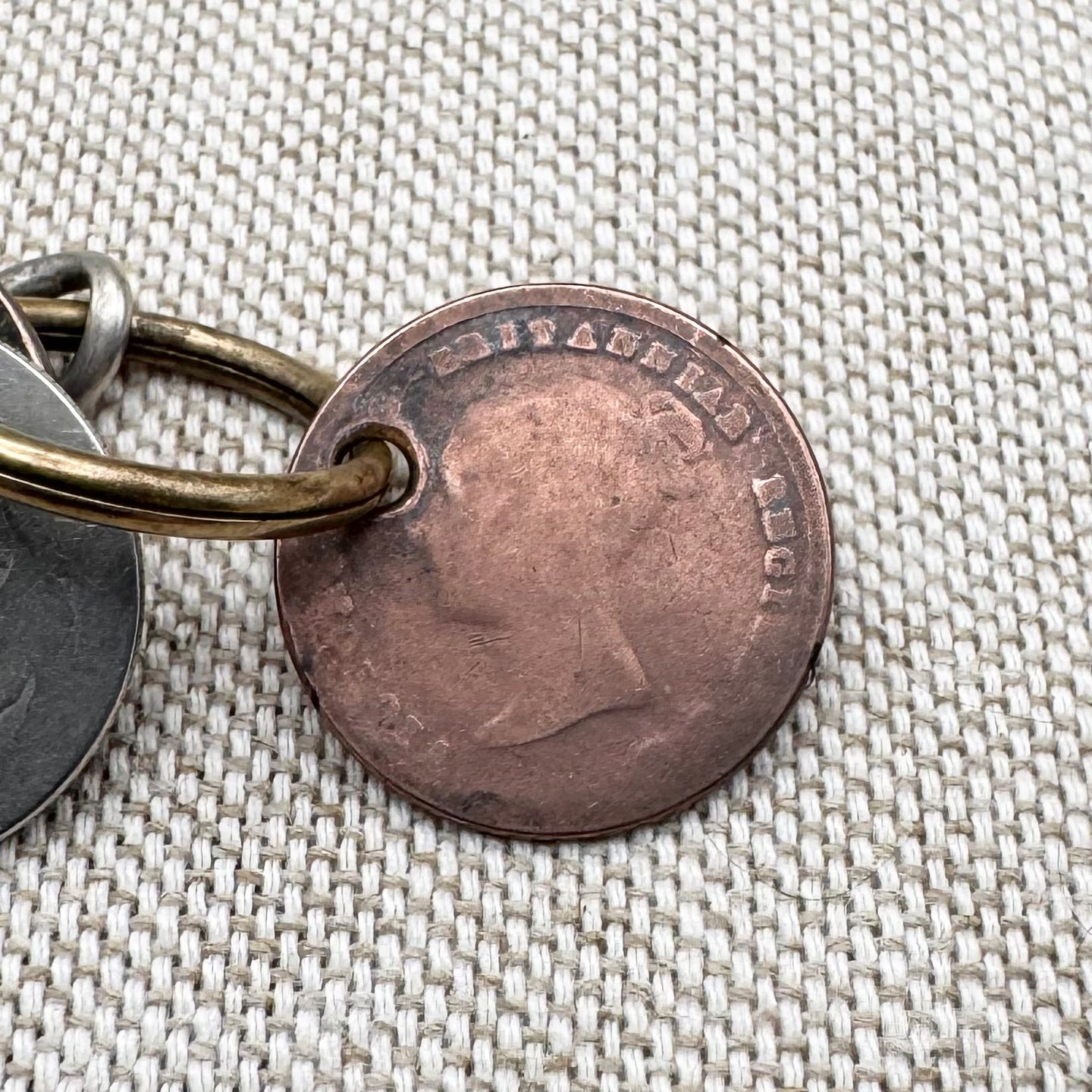 Edwardian silver medallion keyring with historic coin charms, hallmarked Birmingham 1906