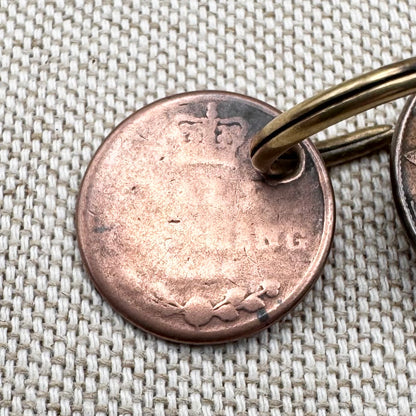 Edwardian silver medallion keyring with historic coin charms, hallmarked Birmingham 1906