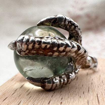 Silver pendant with pale green glass sphere