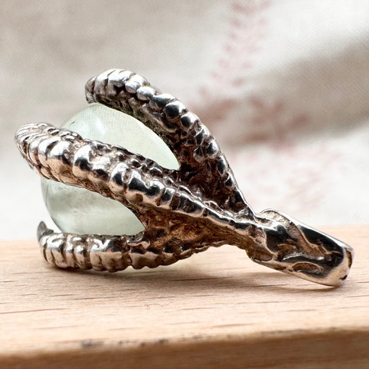 Silver pendant with pale green glass sphere