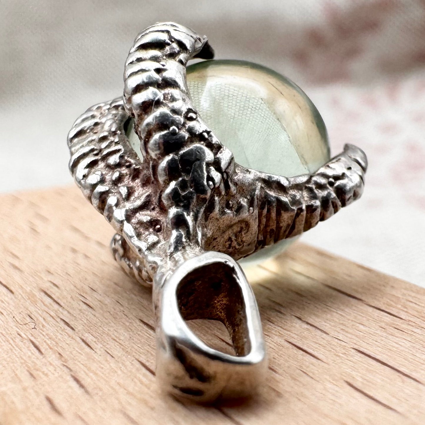 Silver pendant with pale green glass sphere