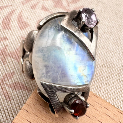 Silver moonstone ring with lilac and red stone accents, size R.5 (US 9)