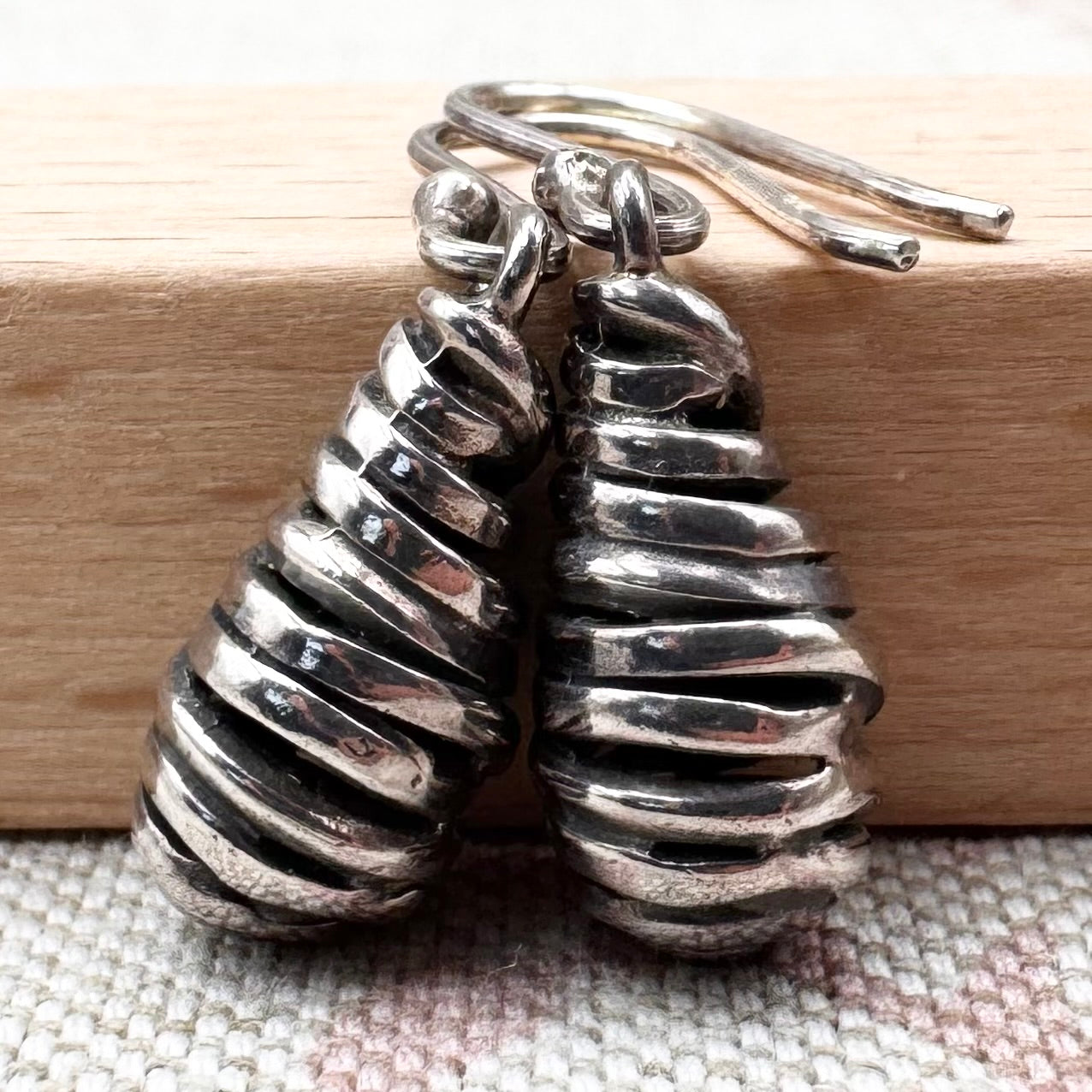 Silver spiral drop earrings with sculptural organic form