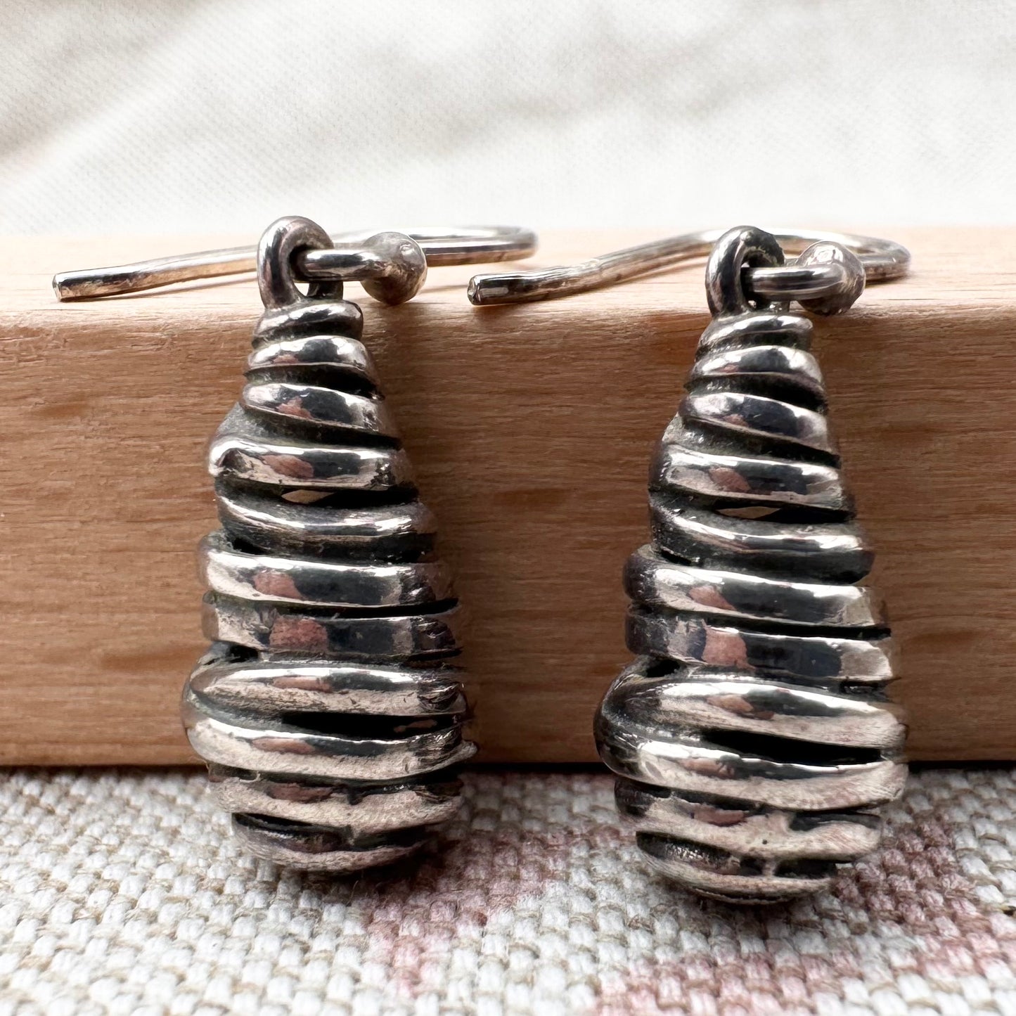 Silver spiral drop earrings with sculptural organic form
