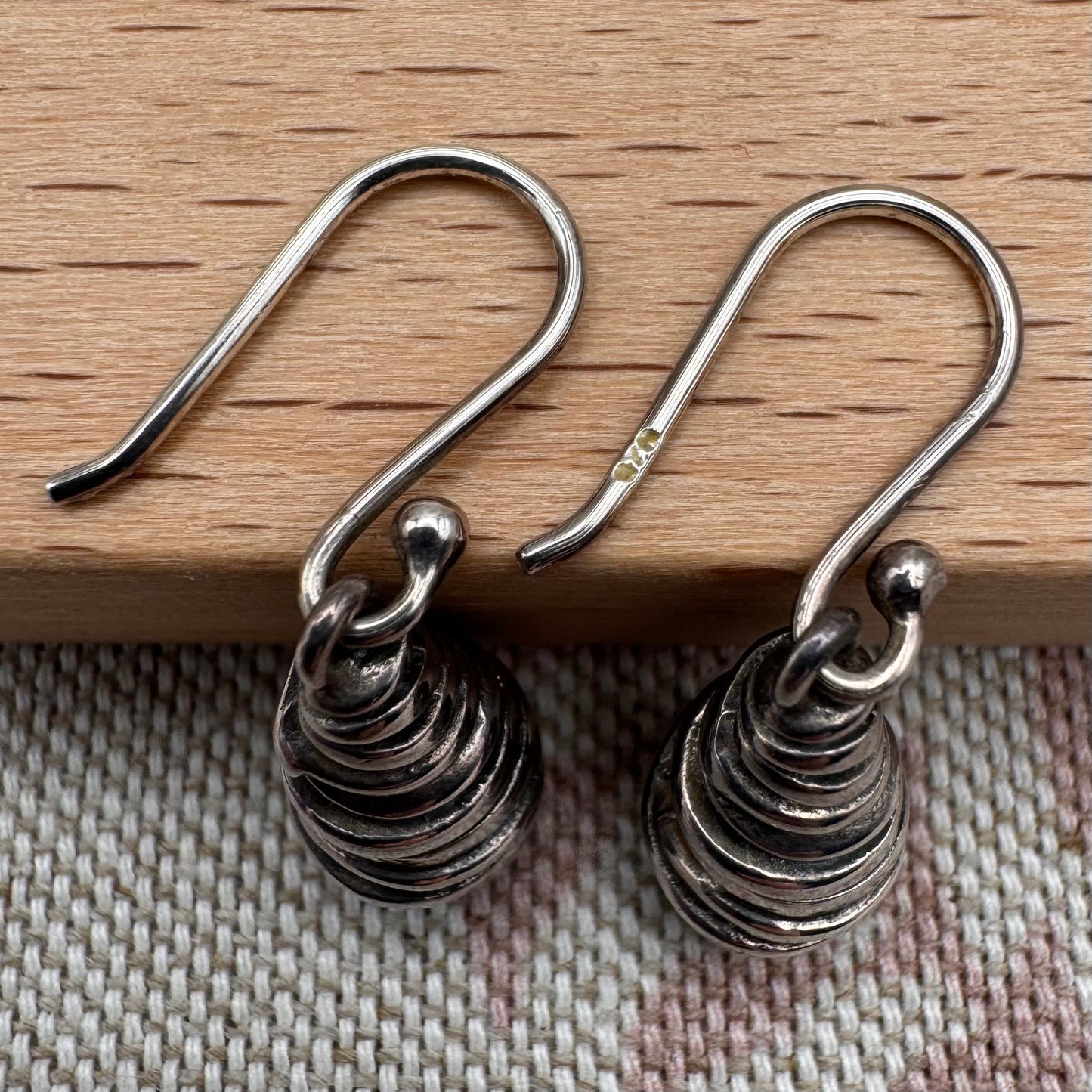 Silver spiral drop earrings with sculptural organic form