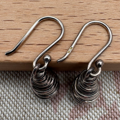Silver spiral drop earrings with sculptural organic form