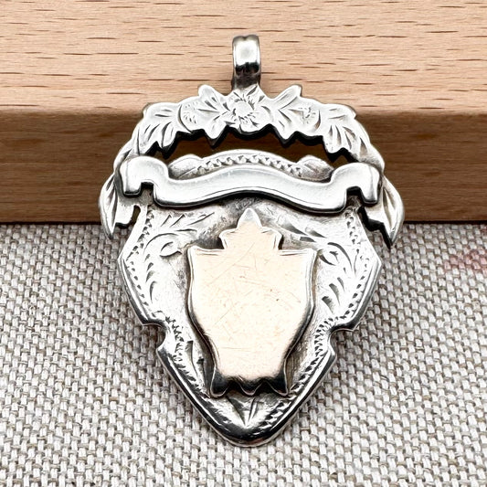 Antique unengraved silver medal fob, hallmarked Chester 1905