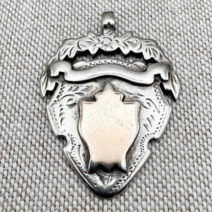 Antique unengraved silver medal fob, hallmarked Chester 1905