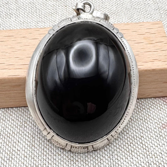 Large silver and black onyx pendant