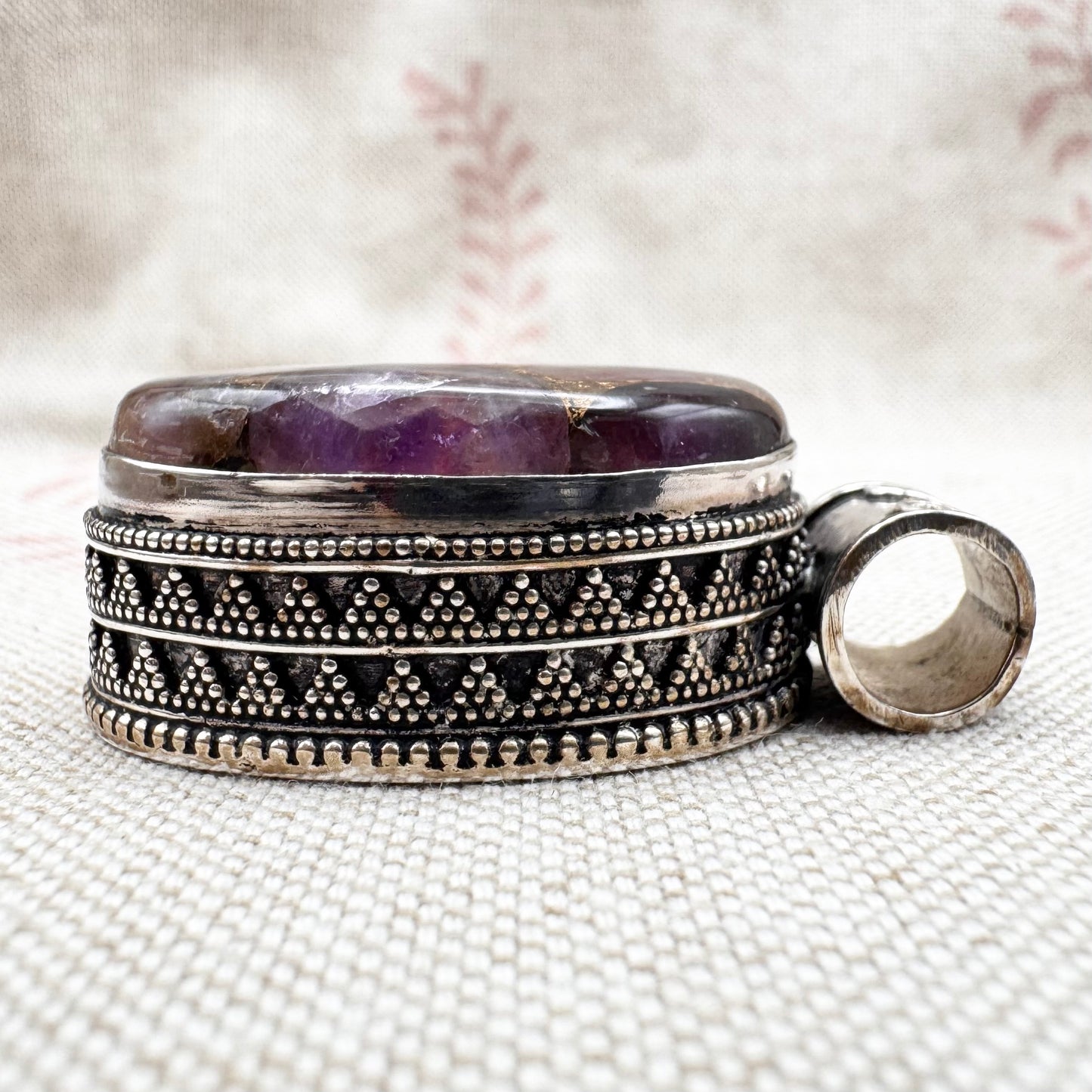 Chunky silver pendant with purple composite stone