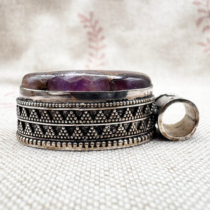 Chunky silver pendant with purple composite stone