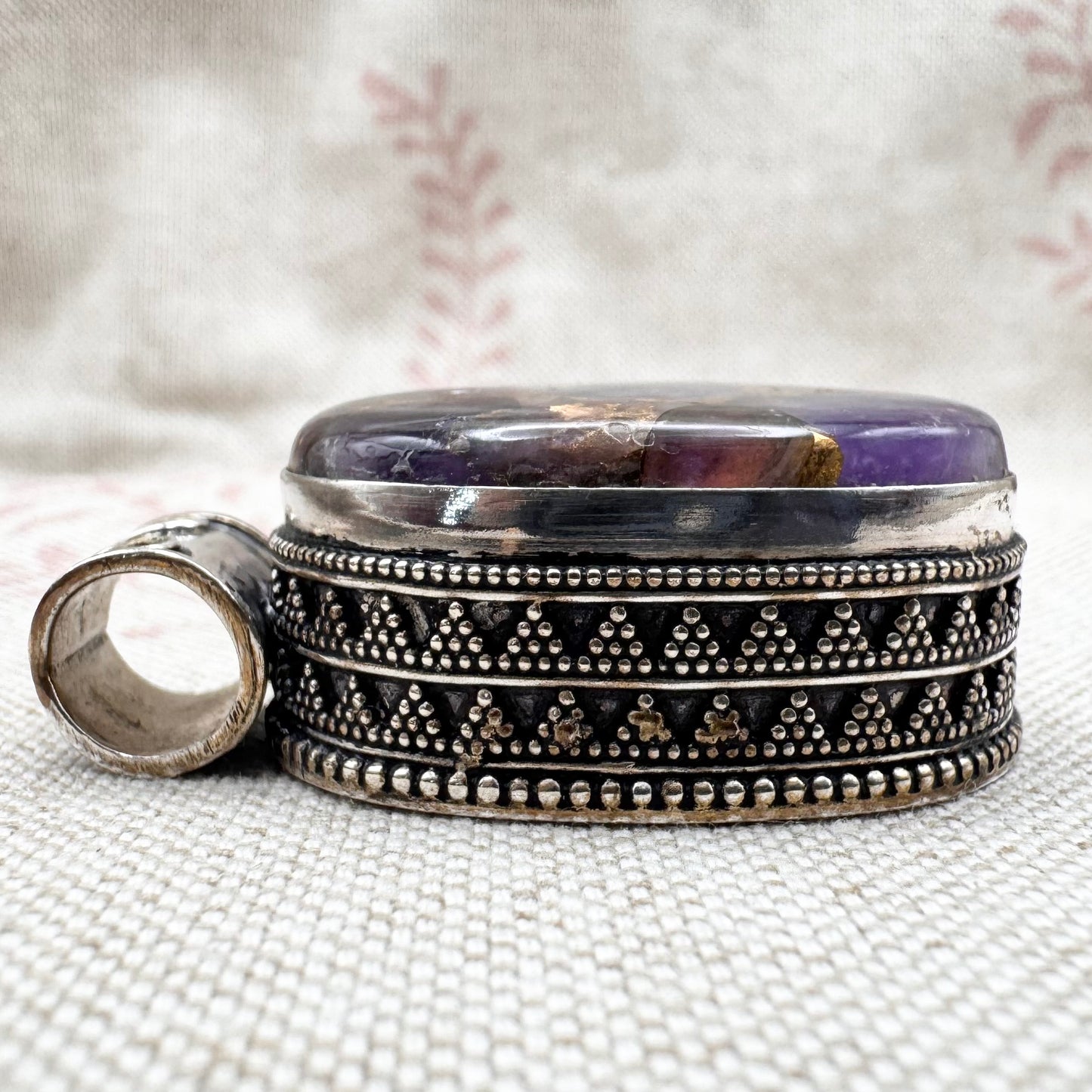 Chunky silver pendant with purple composite stone