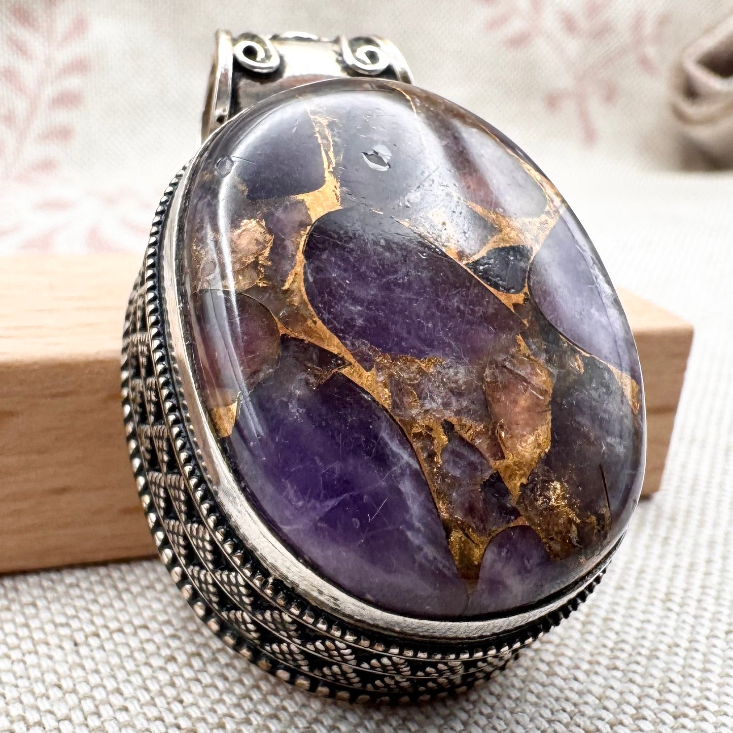 Chunky silver pendant with purple composite stone