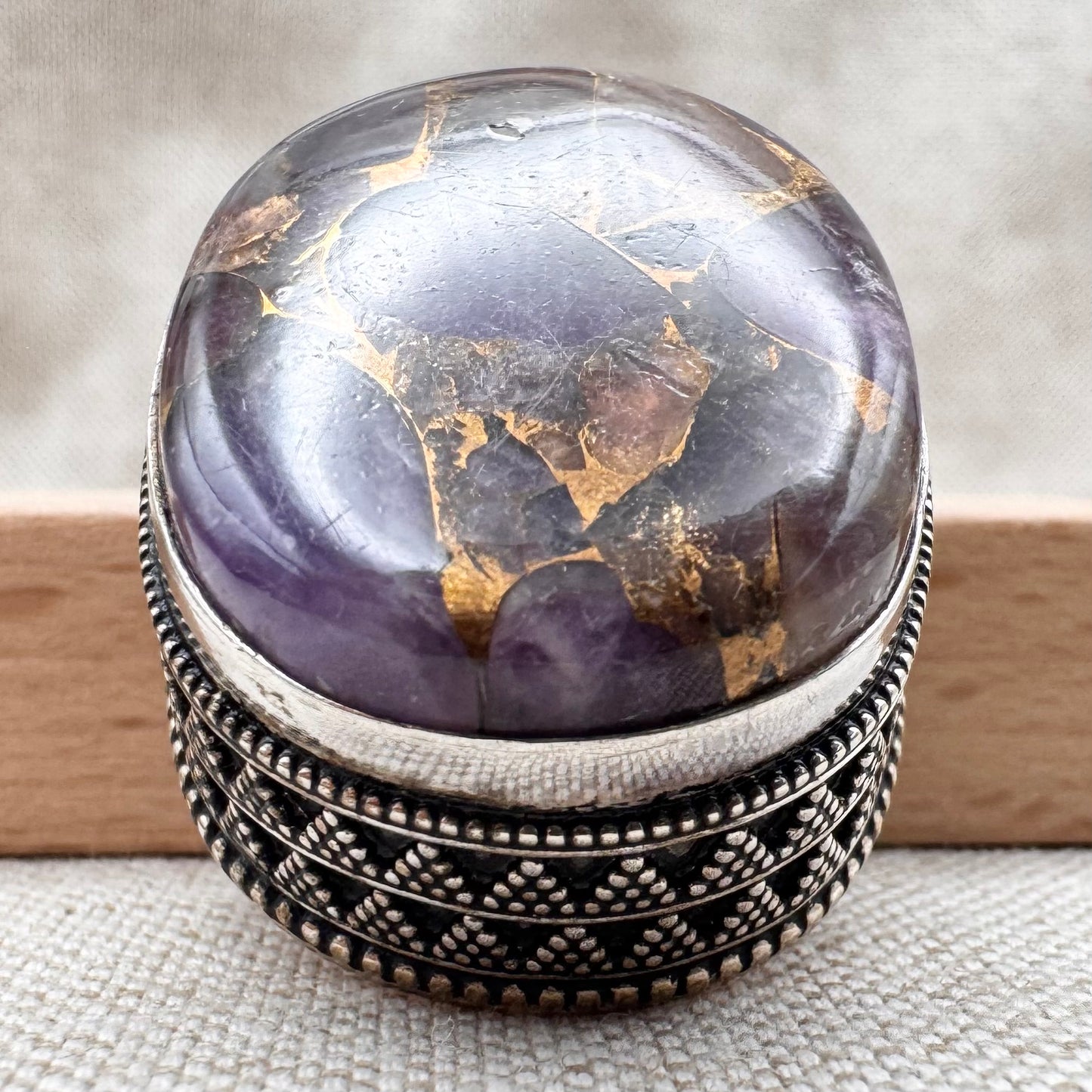 Chunky silver pendant with purple composite stone