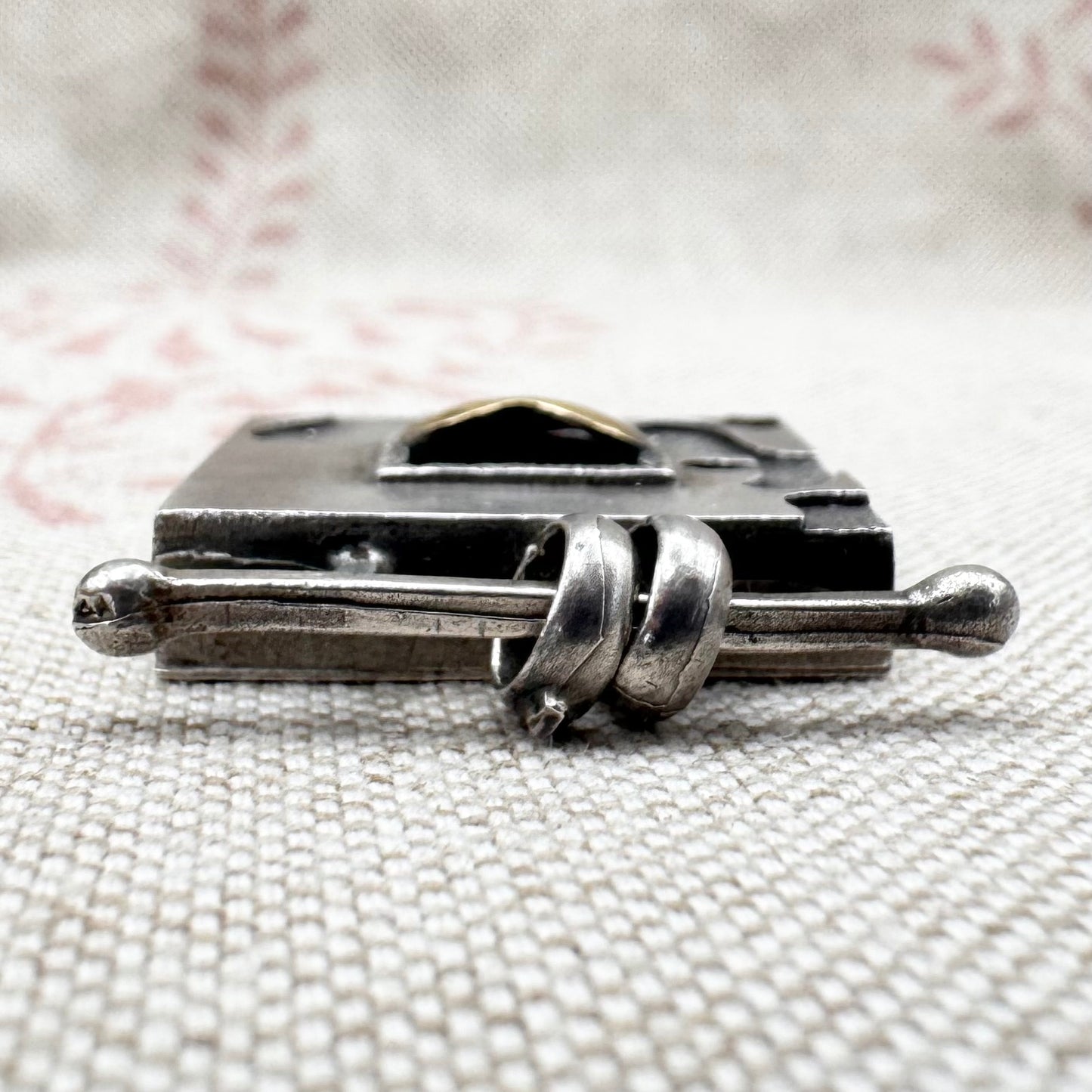 Vintage artisan silver pendant with heart detail