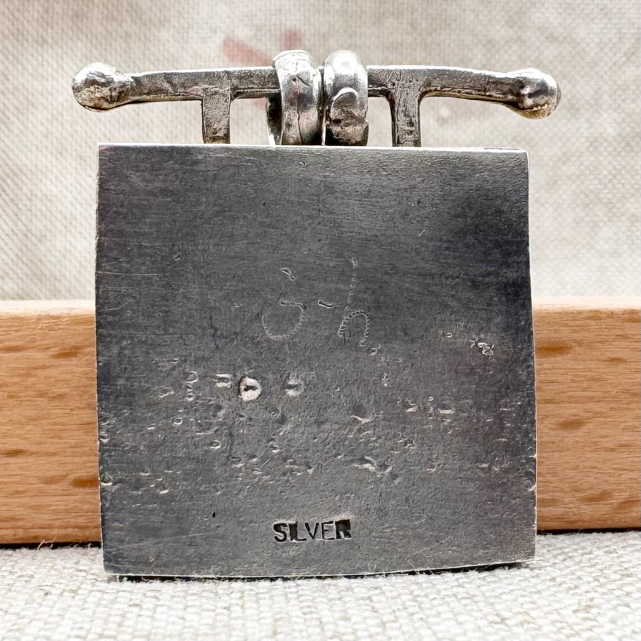 Vintage artisan silver pendant with heart detail