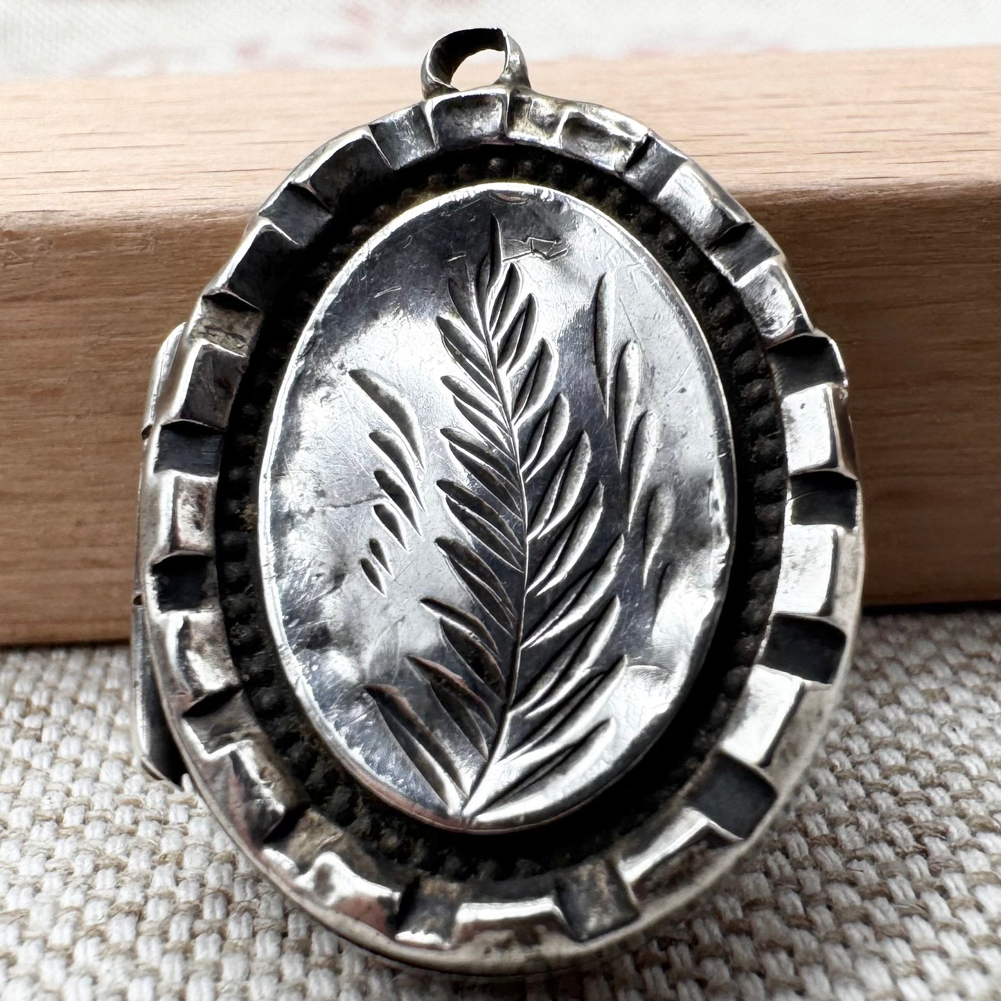 Victorian silver locket with engraved fern design, hallmarked Birmingham 1885